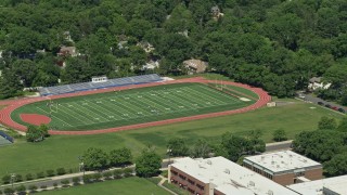 AX82_104 - 4.8K stock footage aerial video of Princeton High football field, Princeton New Jersey