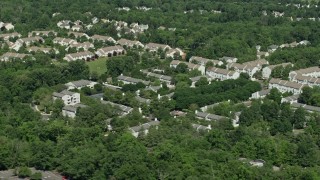AX82_106 - 4.8K aerial stock footage of an apartment complex and trees in Princeton, New Jersey