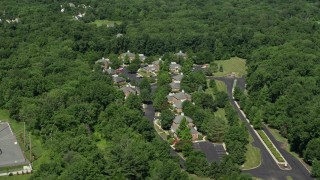 AX82_107 - 4.8K aerial stock footage of an office complex bordered by trees, Princeton, New Jersey