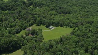 AX83_008 - 4.8K aerial stock footage of a rural home with a barn in Belle Mead, New Jersey
