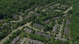 AX83_011 - 4.8K aerial stock footage of condominium complex surrounded by forests, Skillman, New Jersey