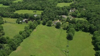 AX83_035 - 4.8K aerial stock footage flying by rural homes in Princeton, New Jersey
