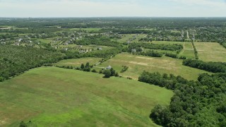 AX83_040 - 4.8K aerial stock footage of rural homes and green fields, Franklin Park, New Jersey