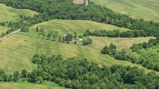 AX83_042 - 4.8K aerial stock footage of an isolated rural home and green fields in Hillsborough Township, New Jersey