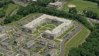 AX83_048 - 4.8K aerial stock footage of modern apartment complex in Somerset, New Jersey
