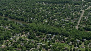 AX83_052 - 4.8K aerial stock footage of suburban neighborhoods around Lake Nelson in Piscataway Township, New Jersey
