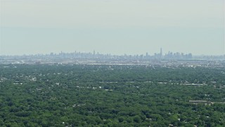 AX83_062 - 4.8K aerial stock footage of a distant view of Lower and Midtown Manhattan, New York seen from New Jersey 