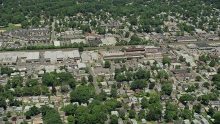 AX83_064 - 4.8K aerial stock footage flying over homes near warehouse buildings and small factory in Garwood, New Jersey