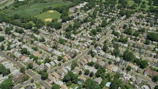 AX83_071E - 4.8K aerial stock footage flying over homes and golf course, Union, New Jersey