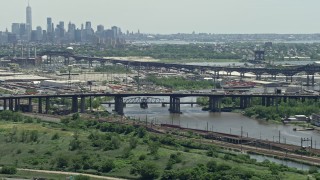 AX83_098 - 4.8K aerial stock footage of a small bridge over the Passaic River in Kearny, New Jersey