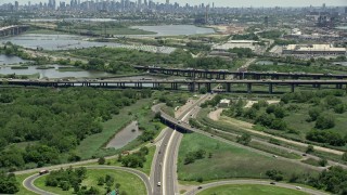 AX83_099 - 4.8K aerial stock footage approaching New Jersey Turnpike with traffic, Kearny, New Jersey