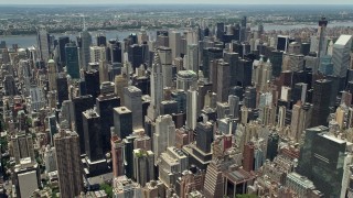 AX83_128E - 4.8K aerial stock footage of Chrysler Building and Midtown Manhattan skyscrapers revealing Citigroup Center, New York City