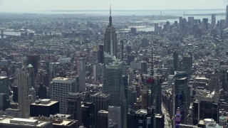 AX83_142 - 4.8K aerial stock footage approaching Empire State Building and Bank of America Tower, Midtown Manhattan, New York City