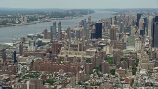 AX83_147 - 4.8K aerial stock footage of Hell's Kitchen skyscrapers by the Hudson River, Midtown Manhattan, New York City