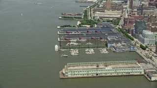 AX83_148 - 4.8K aerial stock footage of boats docked at Chelsea Piers, New York City