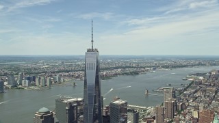 AX83_163 - 4.8K aerial stock footage of One World Trade Center tilt down to reveal World Trade Center Memorial, Lower Manhattan, New York City