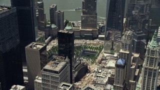 AX83_164 - 4.8K aerial stock footage of World Trade Center Memorial, tilt to reveal One World Trade Center, Lower Manhattan, New York City