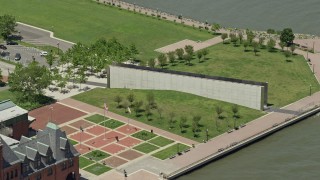 AX83_169E - 4.8K aerial stock footage orbiting Empty Sky Memorial in Liberty State Park, Jersey City, New Jersey