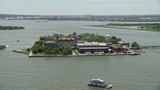 AX83_173 - 4.8K aerial stock footage of Ellis Island in New York Harbor, New York City