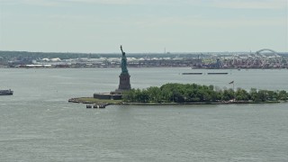 AX83_174 - 4.8K aerial stock footage orbiting Statue of Liberty in New York Harbor, New York City