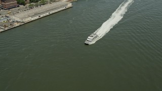 AX83_181 - 4.8K aerial stock footage tracking a ferry cruising on the East River, New York City