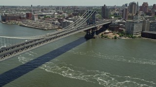 AX83_186 - 4.8K aerial stock footage panning across Manhattan Bridge and approach Brooklyn, New York City