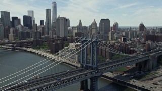AX83_187 - 4.8K aerial stock footage of light traffic on the Manhattan Bridge in New York City