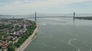 AX83_204E - 4.8K aerial stock footage approaching Shore Parkway and Verrazano-Narrows Bridge, New York Harbor