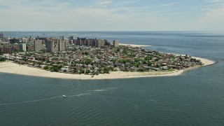 AX83_210 - 4.8K aerial stock footage flying by Coney Island neighborhoods and beaches, Brooklyn, New York City