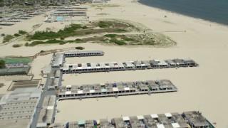 AX83_234 - 4.8K aerial stock footage flying over sunbathers by Catalina Beach Club in Atlantic Beach, Long Island, New York