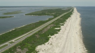 AX83_254 - 4.8K aerial stock footage flying by Light Traffic on Ocean Parkway, Wantagh, New York