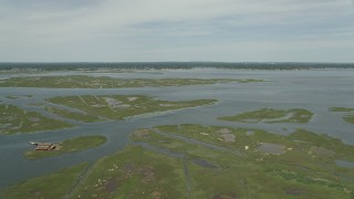 AX83_255E - 4.8K aerial stock footage flying over marshy islands in South Oyster Bay near Massapequa, New York