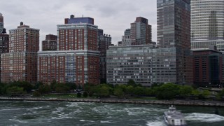 AX84_016E - 4K aerial stock footage of the World Trade Center, Tribeca skyscrapers and office buildings, New York, New York