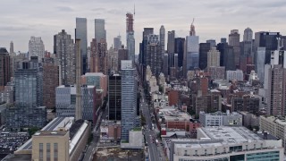 AX84_025E - 4K aerial stock footage flying by skyscrapers in Midtown and on the Upper West Side, New York City