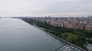 AX84_028E - 4K aerial stock footage of flying by Riverside Park on the Upper West Side, New York City