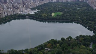 AX84_042 - 4K stock footage aerial video Flying over Central Park, revealing Midtown Manhattan, New York, New York