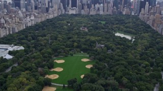 AX84_043 - 4K aerial stock footage Flying over Central Park, revealing Midtown Manhattan, New York, New York
