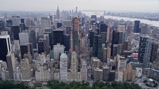AX84_047E - 4K aerial stock footage tilt from Central Park to reveal Times Square in Midtown Manhattan, New York City