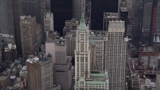 AX84_084 - 4K aerial stock footage Flying by Woolworth Building, Lower Manhattan, New York, New York