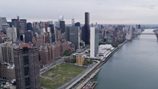 AX84_136 - Aerial stock footage of 4K Aerial Video Flying by United Nations, Midtown Manhattan, New York, New York