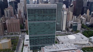 AX84_137E - 4K aerial stock footage of the United Nations building in Midtown Manhattan, New York City
