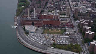 AX84_149E - 4K aerial stock footage tilt from Consolidated Edison Company in East Village to reveal Lower Manhattan, New York City