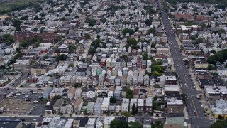 AX84_171 - Aerial stock footage of 4K Aerial Video Flying by residential neighborhoods, Bayonne, New Jersey