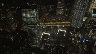 AX85_029 - 4K aerial stock footage of the World Trade Center Memorial, Lower Manhattan, New York, New York, night