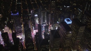 AX85_040 - 4K aerial stock footage Times Square, skyscrapers, Midtown Manhattan, New York, New York, night
