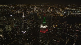 AX85_047 - 4K aerial stock footage Flying by Empire State Building, Midtown Manhattan, New York, New York, night