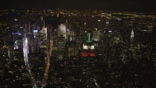 AX85_048 - 4K aerial stock footage Empire State Building, Midtown Manhattan, Times Square, New York, night