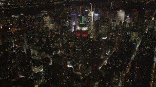 AX85_049 - 4K aerial stock footage Reveal Empire State Building, Midtown Manhattan, New York, New York, night