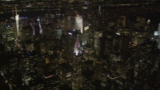 AX85_062 - 4K aerial stock footage Approaching Chrysler Building, Midtown Manhattan, New York, New York, night