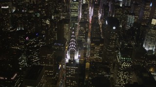AX85_068 - 4K aerial stock footage Flying by Chrysler Building, Midtown Manhattan, New York, New York, night